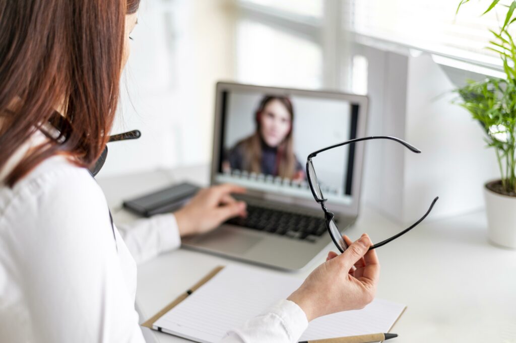 Portrait woman work having video call laptop
